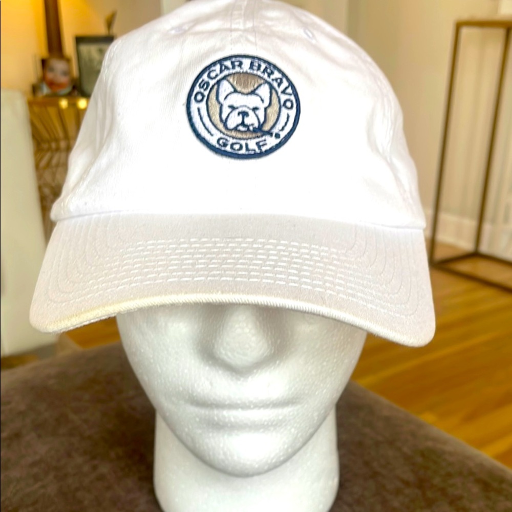 Used, in great shape…Oscar Bravo Golf White Cap.  Cool Frenchie smoking a cigar